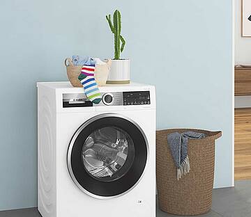 Zeitgemäße Wäschepflege mit modernen Waschmaschinen und Wäschetrocknern verringert die CO2-Emission, spart Energie und