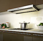 Berbel Moveline: die erste Einbauhaube mit Lift; sie wird komfortabel per Fernsteuerung aus- und eingefahren